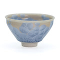 Icy Blue Hanakessho Crystal Glaze Tenmoku Chawan - front view of the tenmoku-shaped bowl with icy blue crystal glaze over warm beige