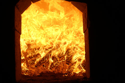 Flames burning inside a pottery kiln