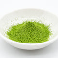 Hika - Shiga Matcha - angled view of the green matcha powder in a white dish