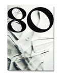 Cover of Eighty issue 18, a large black numeral 80 set over a black-and-white abstract photograph of creased white material