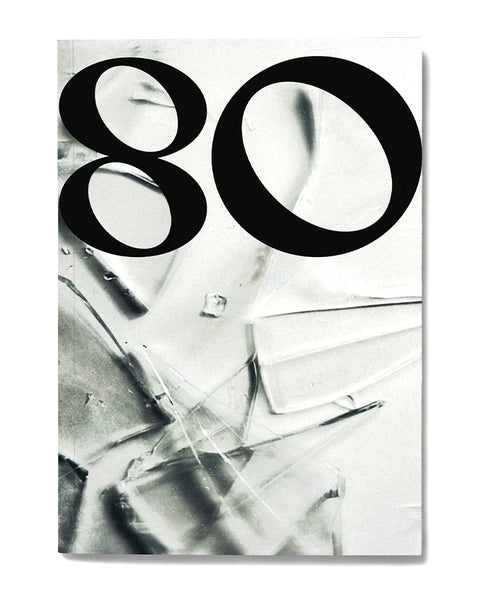 Cover of Eighty issue 18, a large black numeral 80 set over a black-and-white abstract photograph of creased white material