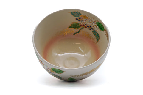 Tezumi — Japanese Matcha Bowl - Floral Kyo-yaki Chawan — tipped to show the interior