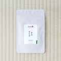 Silver Tezumi pouch of Uji Temomi (宇治 手もみ) gyokuro on a tatami mat.