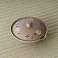Overhead view of the shiboridashi lid showing the carved floral pattern and knob