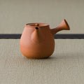Vermilion shudei kyusu teapot, three-quarter view with the spout to the right