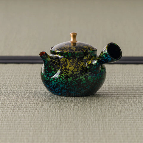 Green-and-gold kyusu with the side handle and spout to the left