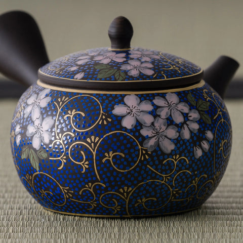 Close view of the kyusu showing the gold vine accents among the blue blossoms