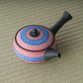 Overhead view of the kyusu showing the blue ring-pattern decoration on the lid