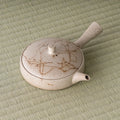 Overhead three-quarter view emphasizing the wide, shallow form of the kyusu