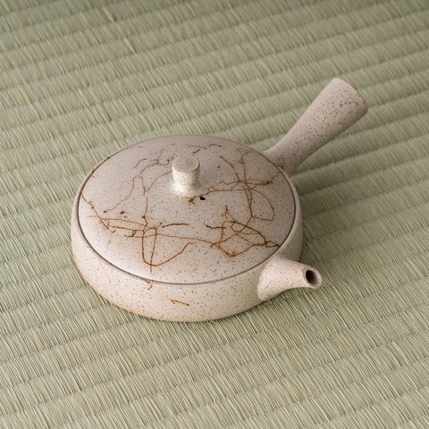 Overhead three-quarter view emphasizing the wide, shallow form of the kyusu