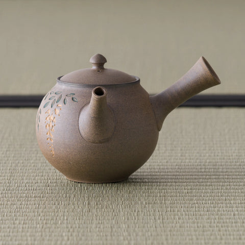 Grey-brown kyusu teapot, three-quarter view with the spout to the right