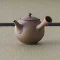 Grey-brown kyusu with the spout angled to the left
