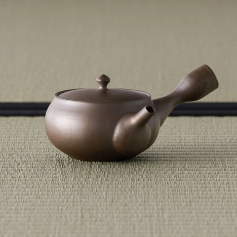 Purple-brown clay kyusu teapot, three-quarter view with the spout to the right