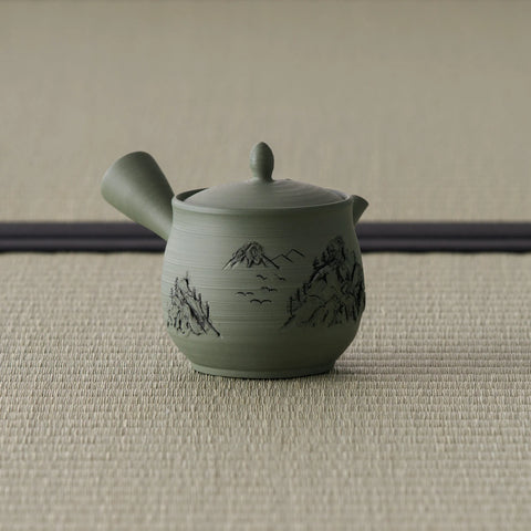 Green celadon kyusu teapot, three-quarter view with the spout to the right