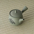 Overhead view of the green kyusu showing the lid, knob and side handle