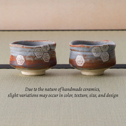 Two Nezumi Shino chawan side by side, with a note that handmade ceramics vary slightly.