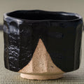 Oharagi Seto-guro matcha bowl, three-quarter view showing the black glaze and exposed foot