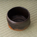 Kuro-raku black raku matcha bowl, overhead view into the dark glazed interior