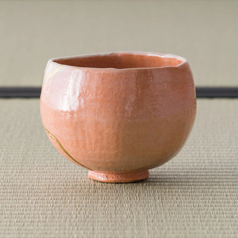 Aka-raku Seppo red raku matcha bowl, front view on tatami
