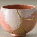 Aka-raku Seppo red raku matcha bowl, front view of the snow-capped white and red glaze