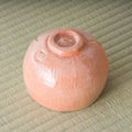 Aka-raku Seppo red raku matcha bowl, underside view showing the foot