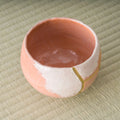Aka-raku Seppo red raku matcha bowl, angled view into the red glazed interior