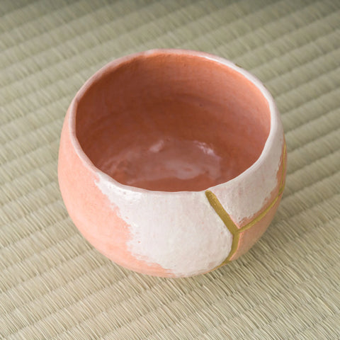 Aka-raku Seppo red raku matcha bowl, angled view into the red glazed interior