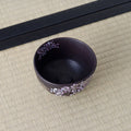 Black Weeping Sakura Chawan photographed at an angle from above, looking into the empty bowl