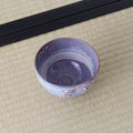 Looking down into the Purple Weeping Sakura Chawan on tatami, its interior swept with pale brushwork