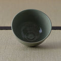 Grey-green celadon tea bowl viewed from above, glazed interior.