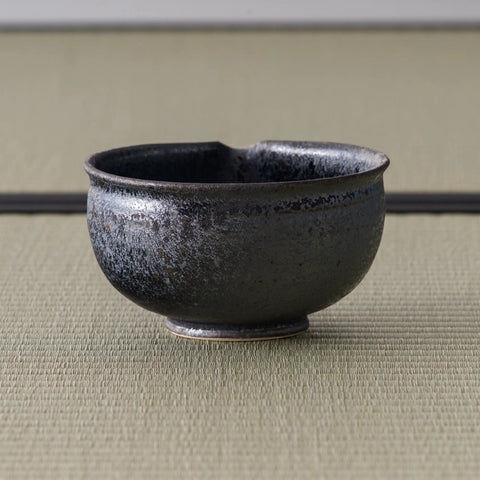 High angle of the metallic-grey chawan showing the rim and interior