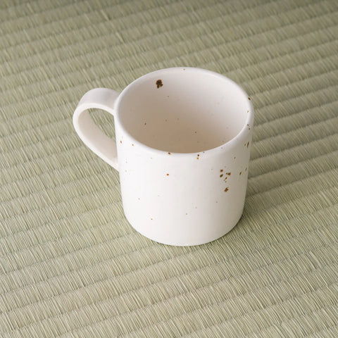 High angle looking into the pink speckled mug showing the glazed interior