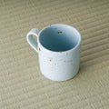 High angle looking into the blue-grey mug showing the glazed interior
