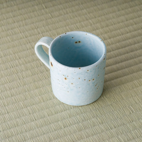 High angle looking into the blue-grey mug showing the glazed interior