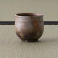 Front view of the wood-fired yunomi showing the mottled brown fire-coloring