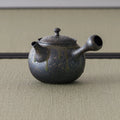 Front view of the bronze-grey kyusu showing the lid and knob