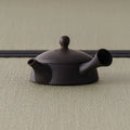 Front view of the two-tone kyusu showing the domed lid and knob