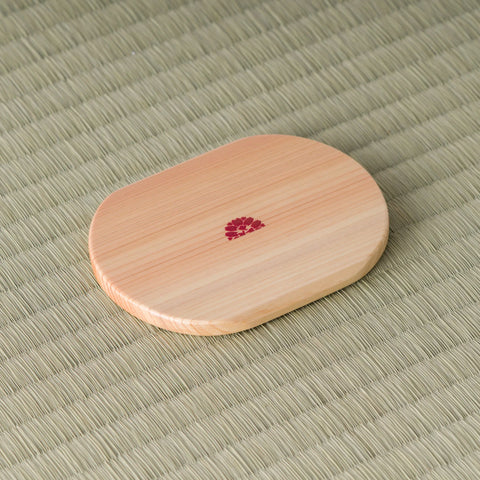 Underside of the oval wooden chataku showing a small red maker's seal