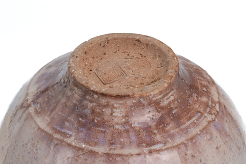Underside of the beige Hagi spouted matcha bowl showing the exposed clay foot ring and concentric throwing marks