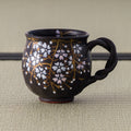 Black Weeping Sakura Mug - side view of the black Kyo-yaki mug with handle
