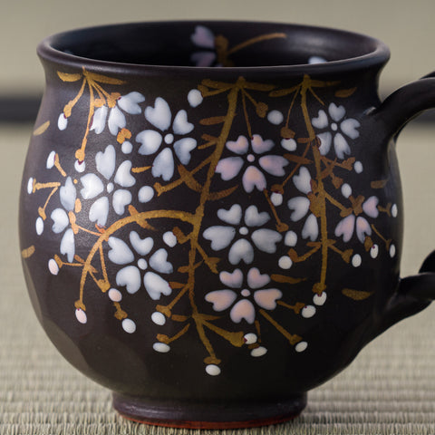 Black Weeping Sakura Mug - closeup of the hand-painted weeping cherry blossoms on the front