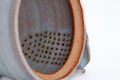 Two-tone Purple Hagi-yaki Teapot - closeup of the ceramic do-ake filter holes inside the body