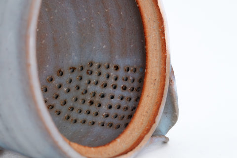 Two-tone Purple Hagi-yaki Teapot - closeup of the ceramic do-ake filter holes inside the body