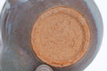 Two-tone Purple Hagi-yaki Teapot - closeup of the unglazed clay underside and foot