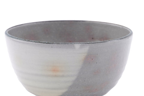 Side view showing the glaze gradient and faint pink gohon spots.
