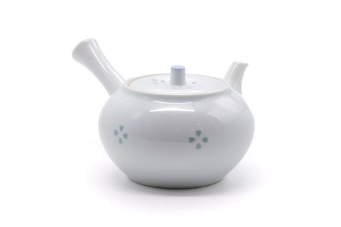 Side profile of the kyusu showing the hollow side handle and curved spout.