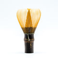 Kurotake Shin Chasen - Dark Bamboo Matcha Whisk - front view showing the pale tines and dark bamboo handle