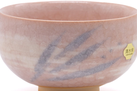 Wide side view showing the pink glaze and pale-blue snowflake marks.