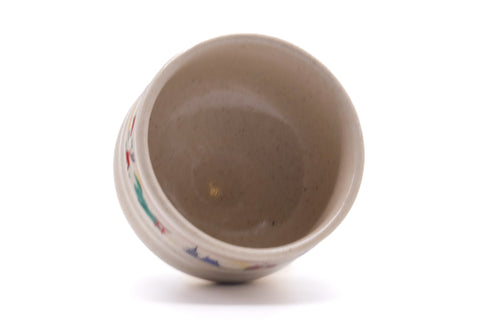 The bowl tilted to reveal the foot and underside.