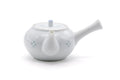 Front view of the white Arita-yaki kyusu showing the domed lid and short spout.